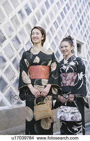 Two young women wearing kimono View Large Photo Image Picture - Two young women wearing kimono. Fotosearch