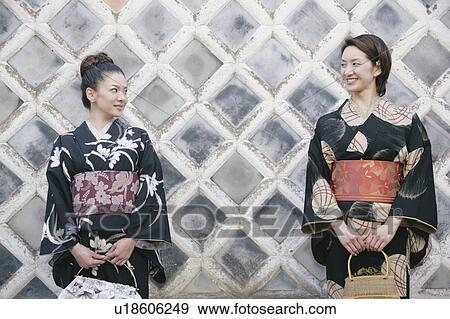 Two young women wearing kimono View Large Photo Image Stock Photo - Two young women wearing kimono. Fotosearch