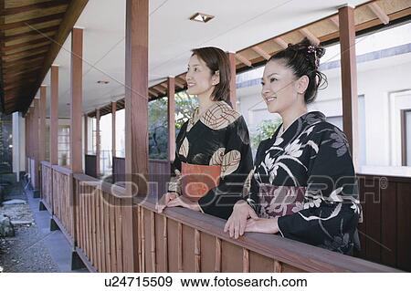 Two young women wearing kimono View Large Photo Image Stock Photo - Two young women wearing kimono. Fotosearch
