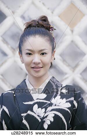 Stock Photography - Young woman wearing kimono. Fotosearch