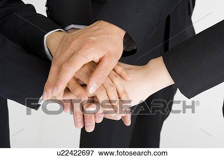 Stock Photo - Business people's hands. Fotosearch
