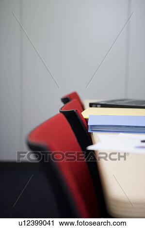 Stock Image - Desk and chairs in board room. Fotosearch