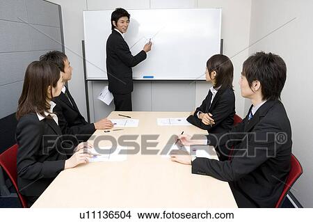 Group of business people having meeting View Large Photo Image Picture - Group of business people having meeting. Fotosearch