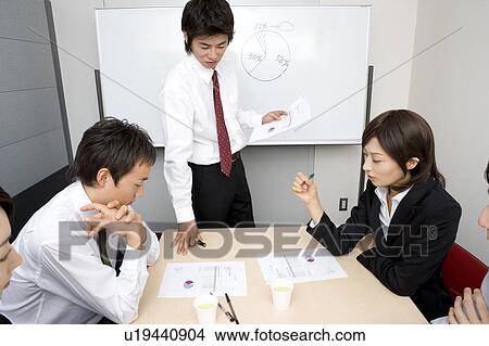 Group of business people having meeting View Large Photo Image Picture - Group of business people having meeting. Fotosearch