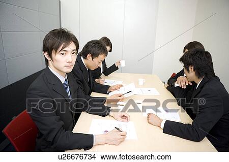 Picture - Group of business people having meeting. Fotosearch