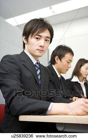 Group of business people having meeting View Large Photo Image Stock Photograph - Group of business people having meeting. Fotosearch