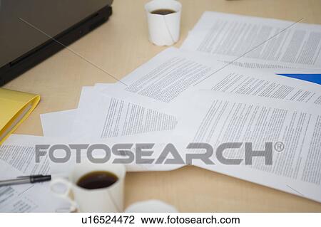 Stock Image - Messy meeting desk. Fotosearch