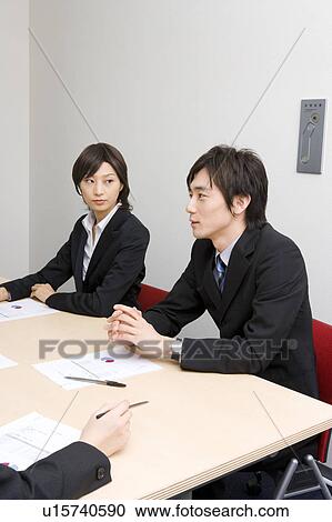 Young business people having meeting View Large Photo Image Stock Image - Young business people having meeting. Fotosearch