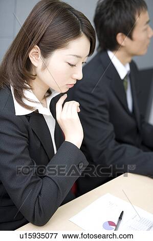 Stock Photo - Young businesswoman in meeting. Fotosearch