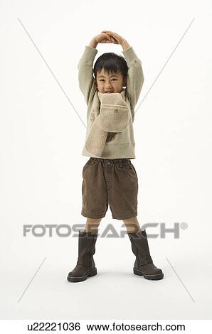 Stock Photograph - Boy standing. Fotosearch