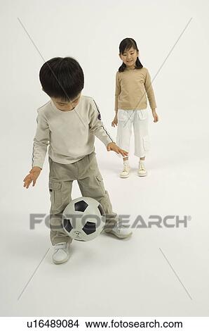 Picture - Children playing with soccer ball. Fotosearch