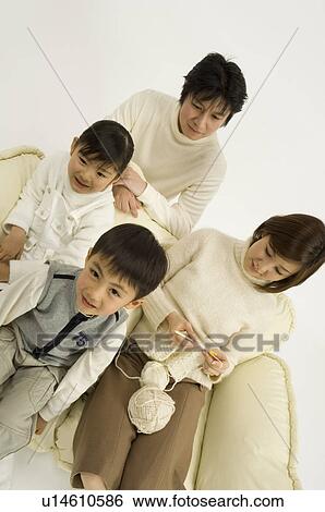 Stock Photograph - Family with mother knitting. Fotosearch