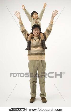 Father carrying son on shoulders View Large Photo Image Picture - Father carrying son on shoulders. Fotosearch