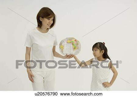 Mother and daughter holding ball View Large Photo Image Stock Image - Mother and daughter holding ball. Fotosearch