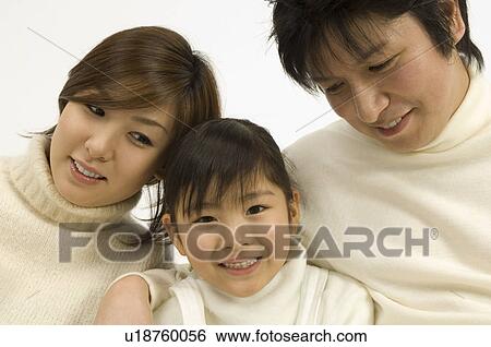 Stock Photograph - Parents and daughter. Fotosearch