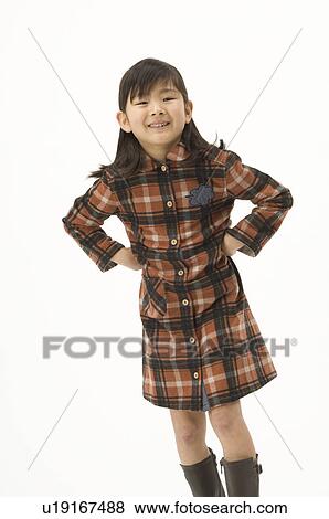 Stock Photo - Portrait of girl standing. Fotosearch