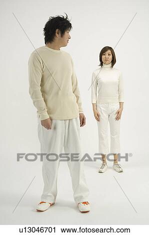 Young couple looking at each other View Large Photo Image Stock Image - Young couple looking at each other. Fotosearch