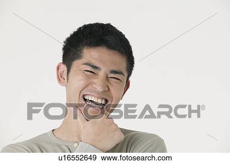 Stock Photo - Portrait of mid adult man. Fotosearch