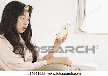 Stock Image - Overslept young woman. Fotosearch