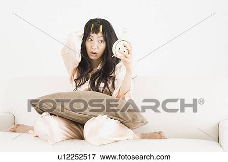 Stock Photo - Overslept young woman. Fotosearch