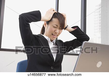 Stock Photo - Stressed young woman. Fotosearch