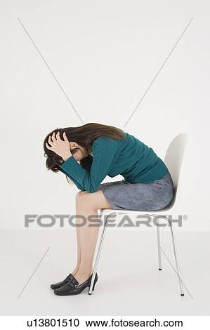 Stock Image - Worried young woman. Fotosearch