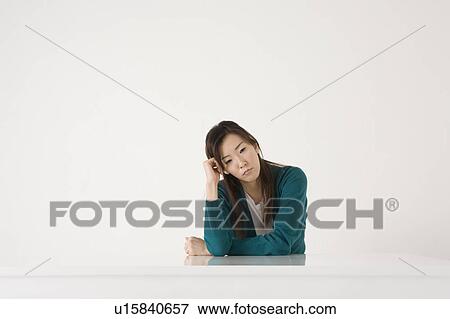 Stock Photo - Worried young woman. Fotosearch