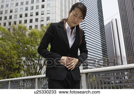 Young woman having stomachache View Large Photo Image Stock Image - Young woman having stomachache. Fotosearch
