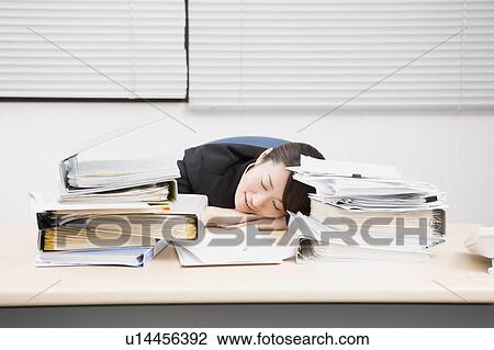Young Woman Sleeping At Desk Stock Image U14456392 Fotosearch