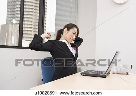 Stock Image - Young woman stretching. Fotosearch