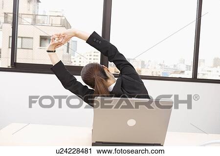 Young woman stretching View Large Photo Image Stock Image - Young woman stretching. Fotosearch