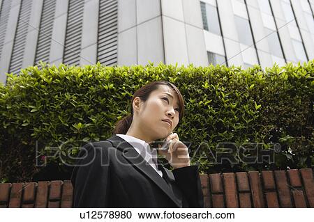 Young woman using mobile phone View Large Photo Image Stock Image - Young woman using mobile phone. Fotosearch