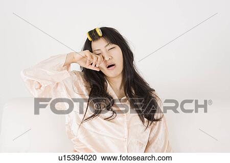 Young woman waking up View Large Photo Image Stock Image - Young woman waking up. Fotosearch