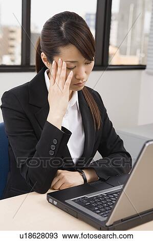 Young woman working on computer View Large Photo Image Stock Image - Young woman working on computer. Fotosearch