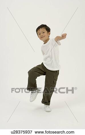 Elementary age boy skipping View Large Photo Image Stock Photo - Elementary age boy skipping. Fotosearch