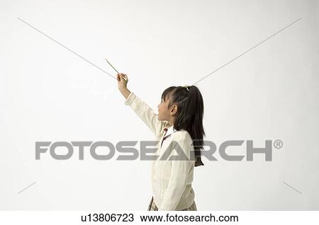 Elementary age girl holding pencil View Large Photo Image Stock Image - Elementary age girl holding pencil. Fotosearch