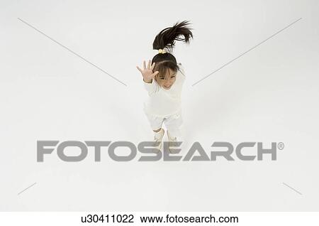 Elementary age girl jumping View Large Photo Image Stock Image - Elementary age girl jumping. Fotosearch