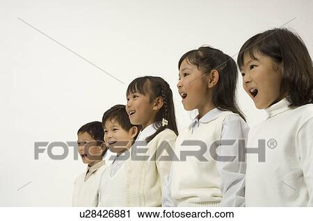 Stock Image - Five elementary age children standing. Fotosearch