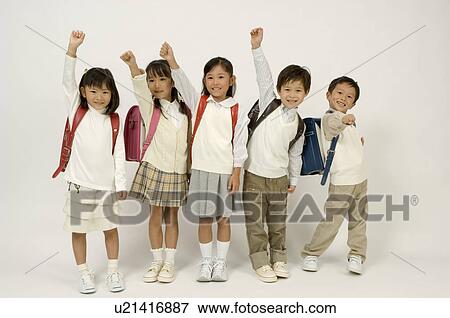 Stock Photo - Five elementary age children standing. Fotosearch