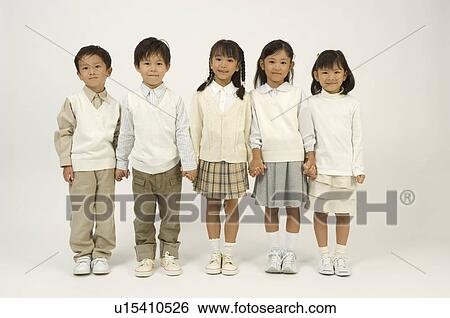 Stock Photograph - Five elementary age children standing. Fotosearch