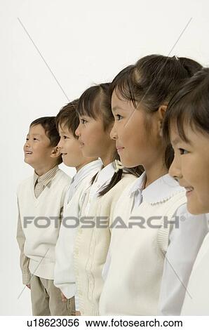 Five elementary age children standing View Large Photo Image Stock Photograph - Five elementary age children standing. Fotosearch