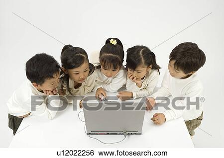 Five elementary age children using laptop View Large Photo Image Stock Photograph - Five elementary age children using laptop. Fotosearch