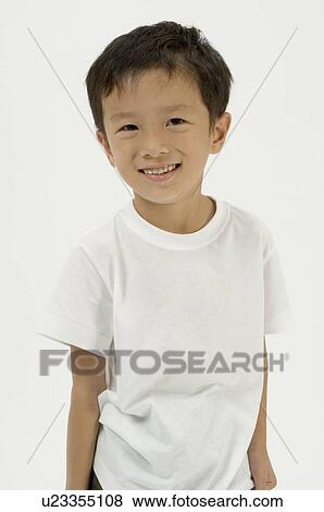 Stock Photo - Portrait of elementary age boy. Fotosearch