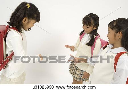Three elementary age girls playing View Large Photo Image Stock Image - Three elementary age girls playing. Fotosearch