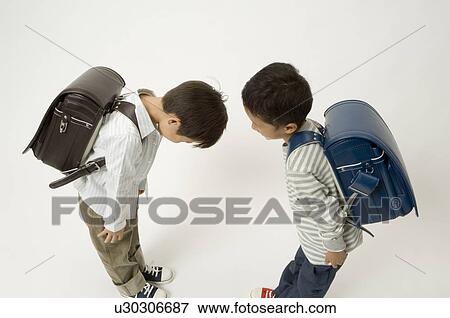 Two elementary age boys bowing View Large Photo Image Stock Photo - Two elementary age boys bowing. Fotosearch