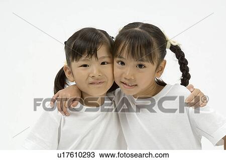 Two elementary age girls looking at camera View Large Photo Image Stock Image - Two elementary age girls looking at camera. Fotosearch
