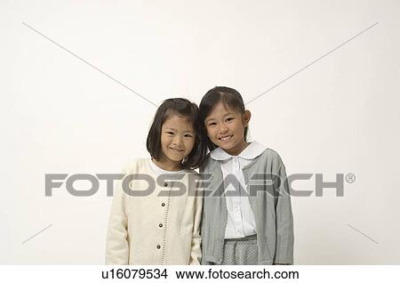 Two elementary age girls smiling View Large Photo Image Picture - Two elementary age girls smiling. Fotosearch