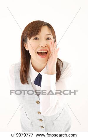 Stock Photo - A woman in formal attire calling somebody. Fotosearch