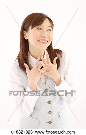 A woman in formal attire expressing her contentment View Large Photo Image Stock Image - A woman in formal attire expressing her contentment. Fotosearch
