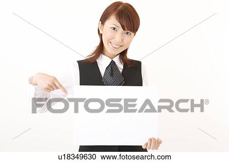 A woman in formal attire holding a blank message View Large Photo Image Stock Image - A woman in formal attire holding a blank message. Fotosearch